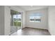 Bright living room with sliding doors opening to patio and stunning water view at 5227 Ligonberry St, Lakeland, FL 33811