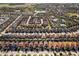 Expansive aerial shot showcases a residential neighborhood, with lush landscaping at 5270 Wildwood Way, Davenport, FL 33837