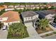 Aerial view of a charming home surrounded by lush landscaping and well-maintained neighborhood at 5270 Wildwood Way, Davenport, FL 33837