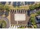 Aerial view showcasing a sand volleyball court with benches at 5270 Wildwood Way, Davenport, FL 33837