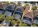 Aerial view of homes featuring screened in pools in a suburban neighborhood at 5270 Wildwood Way, Davenport, FL 33837