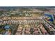 Aerial view of a large suburban community with lush landscaping and multiple lakes and ponds at 5270 Wildwood Way, Davenport, FL 33837