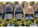 Aerial view of homes featuring screened in pools, backyards, and roof details at 5270 Wildwood Way, Davenport, FL 33837
