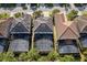 Aerial view of homes featuring screened in pools, and solar panels at 5270 Wildwood Way, Davenport, FL 33837
