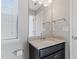 Modern bathroom with granite countertops and dark vanity at 5270 Wildwood Way, Davenport, FL 33837