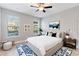 Stylish bedroom showcasing neutral walls, plush carpet, and ample natural light at 5270 Wildwood Way, Davenport, FL 33837