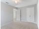Neutral bedroom featuring carpet floors and white trim at 5270 Wildwood Way, Davenport, FL 33837