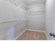 Walk in closet features shelving and carpeted flooring at 5270 Wildwood Way, Davenport, FL 33837