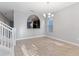 Spacious dining room featuring modern lighting, neutral walls, and tile flooring at 5270 Wildwood Way, Davenport, FL 33837