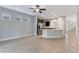 Bright and open kitchen featuring stainless steel appliances, granite counters and center island at 5270 Wildwood Way, Davenport, FL 33837