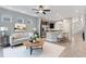 Open concept living area featuring a modern ceiling fan, recessed lighting, and sightlines to the kitchen at 5270 Wildwood Way, Davenport, FL 33837