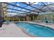 Cool off in this private screened pool with a custom shape and ample space for entertaining at 5270 Wildwood Way, Davenport, FL 33837
