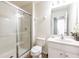 Clean bathroom featuring a glass-enclosed shower and a single sink vanity at 550 Las Fuentes Dr, Kissimmee, FL 34746
