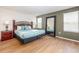 Relaxing bedroom featuring a bed, nightstand, and mirror for a comfortable and stylish retreat at 550 Las Fuentes Dr, Kissimmee, FL 34746