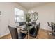 Inviting dining area with stylish table, chairs, and a modern chandelier at 550 Las Fuentes Dr, Kissimmee, FL 34746