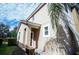 Inviting exterior of home featuring neutral stucco, red-tiled roof, and well-maintained landscaping at 550 Las Fuentes Dr, Kissimmee, FL 34746