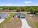Aerial view of gray house and blue driveway at 5835 Sw 154 Lane Rd, Ocala, FL 34473