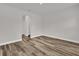 A bright bedroom with wood-look flooring and light walls at 5835 Sw 154 Lane Rd, Ocala, FL 34473