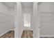 Hallway with access to closets and a partial view of the bathroom at 5835 Sw 154 Lane Rd, Ocala, FL 34473