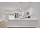Modern kitchen with stainless steel appliances, white cabinetry, and quartz countertops at 5835 Sw 154 Lane Rd, Ocala, FL 34473