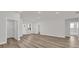 Spacious living room with hardwood floors, white trim and neutral walls at 5835 Sw 154 Lane Rd, Ocala, FL 34473