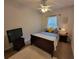 This is a bedroom with an accent wall, a queen-size bed, television and plush white rug at 603 Sanctuary Golf Pl, Apopka, FL 32712