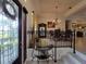 Elegant dining room with modern chandelier, dining table, and open floor plan at 603 Sanctuary Golf Pl, Apopka, FL 32712