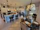 This modern kitchen has a center island, barstool seating, and a dining area, perfect for gatherings at 603 Sanctuary Golf Pl, Apopka, FL 32712
