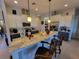 Modern kitchen with stone countertops, pendant lighting, and stainless steel appliances at 603 Sanctuary Golf Pl, Apopka, FL 32712