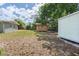 Spacious backyard with lush lawn, sheds, and ample space at 6124 Bear Lake Ter, Apopka, FL 32703