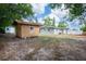 Backyard featuring sheds in a well-maintained lawn at 6124 Bear Lake Ter, Apopka, FL 32703
