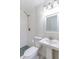Bathroom features pedestal sink, rainfall shower head and mosaic tile flooring at 6124 Bear Lake Ter, Apopka, FL 32703