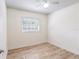 Bedroom with a ceiling fan, new flooring, and natural light at 6124 Bear Lake Ter, Apopka, FL 32703