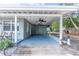 Spacious covered carport with ceiling fans, providing ample parking and outdoor living space at 6124 Bear Lake Ter, Apopka, FL 32703