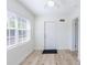 Clean entryway with new flooring and natural light from the front window at 6124 Bear Lake Ter, Apopka, FL 32703