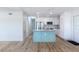 Bright open kitchen with a central island, stainless steel appliances, and stylish cabinetry at 6124 Bear Lake Ter, Apopka, FL 32703
