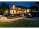Inviting backyard featuring a covered patio, lush landscaping, and a charming walkway perfect for outdoor enjoyment at 616 Grand Cypress Pt, Sanford, FL 32771
