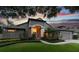 Stunning home exterior with well-manicured landscaping, lush lawn, and a charming walkway leading to the entrance at 616 Grand Cypress Pt, Sanford, FL 32771