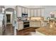 Well-equipped kitchen with stainless steel appliances, granite countertops, and custom cabinetry at 616 Grand Cypress Pt, Sanford, FL 32771