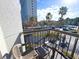 Balcony offering seating with building and palm tree views at 6165 Carrier Dr # 2308, Orlando, FL 32819