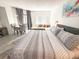 This bedroom offers a peaceful retreat with natural light and ample space to relax and unwind at 6165 Carrier Dr # 2308, Orlando, FL 32819