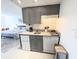 Efficient kitchen provides essential counter space and appliances near the main bedroom and open to living area at 6165 Carrier Dr # 2308, Orlando, FL 32819