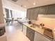 Efficient kitchen with granite countertops and appliances, open to the main bedroom at 6165 Carrier Dr # 2308, Orlando, FL 32819