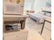 Stylish interior view with a microwave, oven, and comfortable bedroom setup in the background at 6165 Carrier Dr # 2308, Orlando, FL 32819