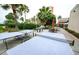 Outdoor recreation area with ping pong, foosball, patio furniture, and lush tropical landscaping near a hotel at 6165 Carrier Dr # 2308, Orlando, FL 32819
