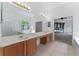 Primary bathroom with dual sinks, a soaking tub, and a glass enclosed shower at 6550 Crestmont Glen Ln, Windermere, FL 34786