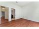 Bright bedroom featuring wood floors and an ensuite bathroom for added convenience at 6550 Crestmont Glen Ln, Windermere, FL 34786