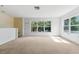 Well-lit bonus room featuring big windows and neutral carpet at 6550 Crestmont Glen Ln, Windermere, FL 34786