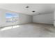 Spacious bonus room with carpet flooring, a window, and natural light at 6550 Crestmont Glen Ln, Windermere, FL 34786