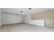 Spacious bonus room with neutral carpet, featuring two doors and a half wall that overlooks the lower level at 6550 Crestmont Glen Ln, Windermere, FL 34786